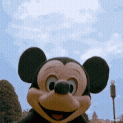 Mickey Mouse Close Up With Blue Sky GIF