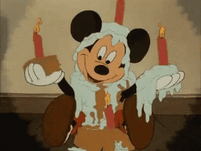 Mickey Mouse Holding Candles And Cake GIF