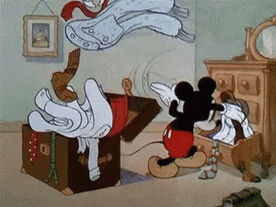 Mickey Mouse Is Opening A Trunk Full Of Clothes GIF