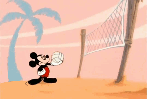 Mickey Mouse Is Playing Volleyball On A Beach . GIF