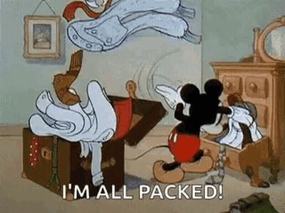 Mickey Mouse Is Standing Next To A Trunk Filled With Clothes And Saying `` I 'M All Packed ! '' GIF