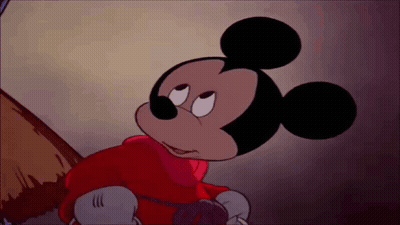Mickey Mouse Is Wearing A Red Jacket And Gloves And Looking At Something . GIF