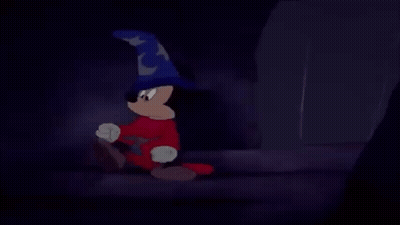 Mickey Mouse Is Wearing A Wizard Hat And Red Pants GIF