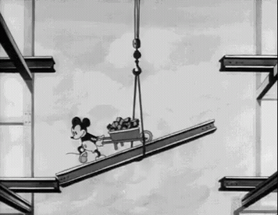 Mickey Mouse Riding Crane On Metal Beam GIF