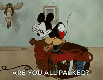 Mickey Mouse Sitting On Suitcase Talking On Phone GIF