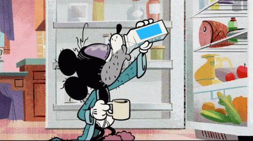 Mickey Mouse Standing in Front of Refrigerator