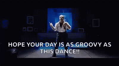 Mickey Mouse Standing Next To A Door GIF