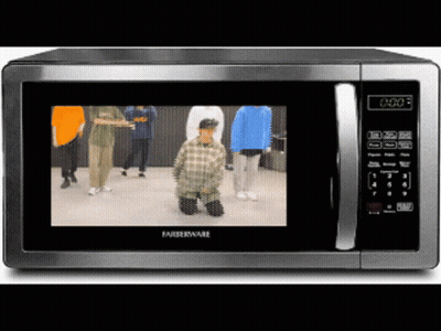 Microwave Showing Dancing People At 0:00 GIF