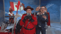 Mike Myers Tossing Money Canada Flag Background GIF