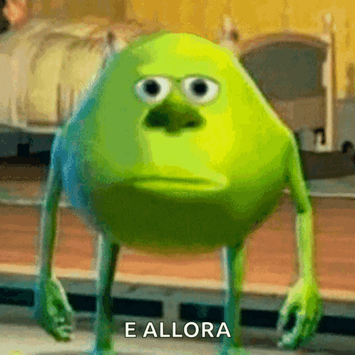 Mike Wazowski From Monsters Inc Has A Sad Look On His Face And The Words E Allora Are Below Him GIF