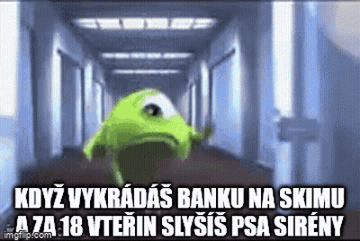 Mike Wazowski From Monsters Inc Is Walking Down A Hallway GIF
