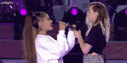 Miley Cyrus Embraces Ariana Grande GIF