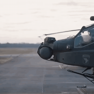 Military Helicopter on Runway With Army Logo