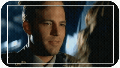 Military Man Looking At Woman In Frame GIF