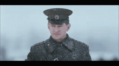 Military Uniform Man Looking At Camera Snow GIF