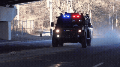 Military Vehicle With Law Enforcement License Plate GIF