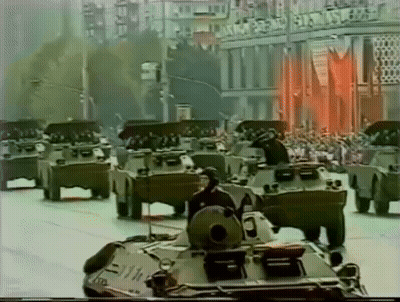 Military Vehicles Driving in Parade