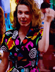 Millie Bobby Brown Checking Her Hair GIF