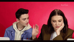 Millie Bobby Brown Pushing Noah Schnapp GIF