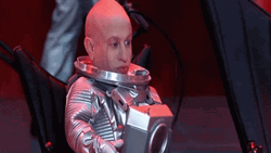 Mini Me Wearing Space Suit GIF