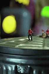 Miniature People Groovy On Tin Can GIF