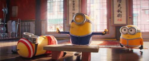 Minions In Room With Chinese Writing On Wall GIF