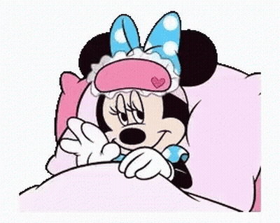 Minnie Mouse Is Sleeping In A Bed With A Sleep Mask On Her Face . GIF