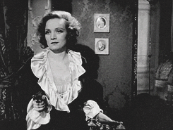 Mischievous Marlene Dietrich Pointing Gun