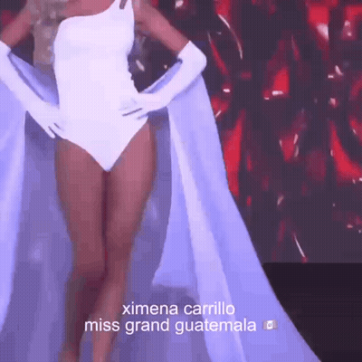 Miss Grand Guatemala In White Swimsuit And Gloves GIF