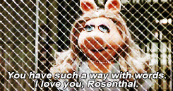 Miss Piggy Behind Fence GIF