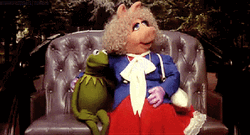 Miss Piggy Sits With Kermit GIF
