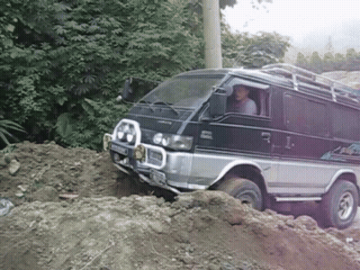 Mitsubishi Van Driving Through Pile Of Dirt GIF