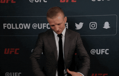 Mixed Martial Artist TJ Dillashaw Signaling Wearing Belt GIF