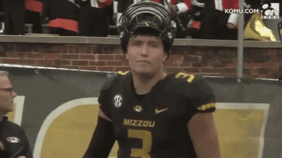 Mizzou Football Player In Helmet By Brick Wall GIF
