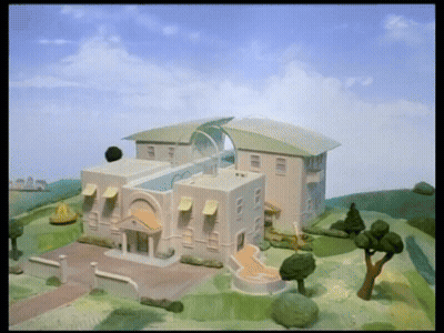 Model House With Blue Sky And Clouds GIF
