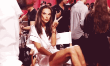 Model Posing Peace Sign GIF