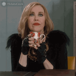 Moira Rose Holding Cup GIF