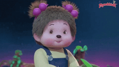 Monchhichi Doll In Yellow Shirt And Overalls With Purple Flowers GIF