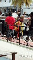 Money Falling In Street Chaotic Crowd GIF