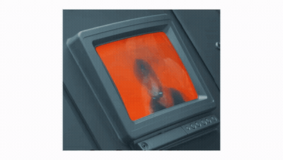 Monitor With Red Screen Showing Man's Face GIF