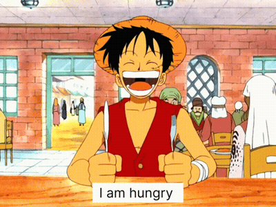 Monkey D Luffy Is Holding A Knife And Fork With A Sign That Says I Am Hungry GIF