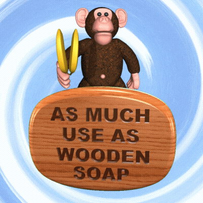 Monkey Holding Banana On Wooden Sign As Much Use As Wooden Soap GIF