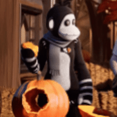 Monkey Holding Pumpkin With Hole GIF