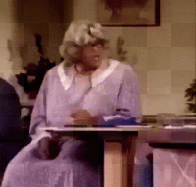Monkey Sitting At Table With Microphone GIF