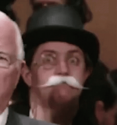 Monopoly Game With Man In Top Hat GIF