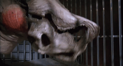 Monster Face In Cage With Bars GIF