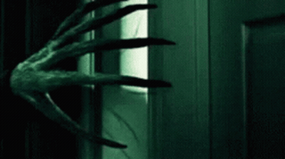 Monster Hand Reaching Into Door GIF