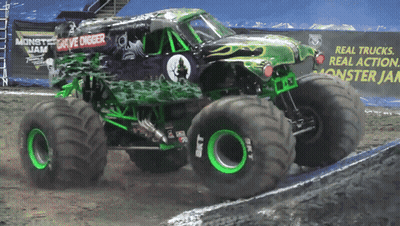 Monster Jam Truck Driving Down Dirt Road GIF