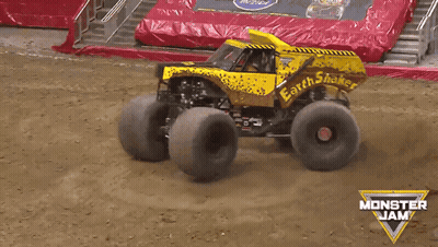 Monster Jam Truck Driving On Dirt Road GIF