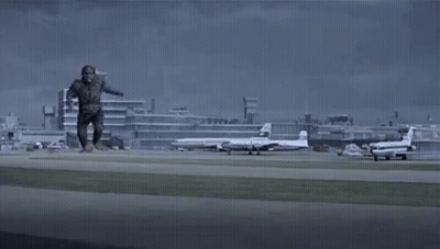 Monster Running On Runway In Front Of City GIF